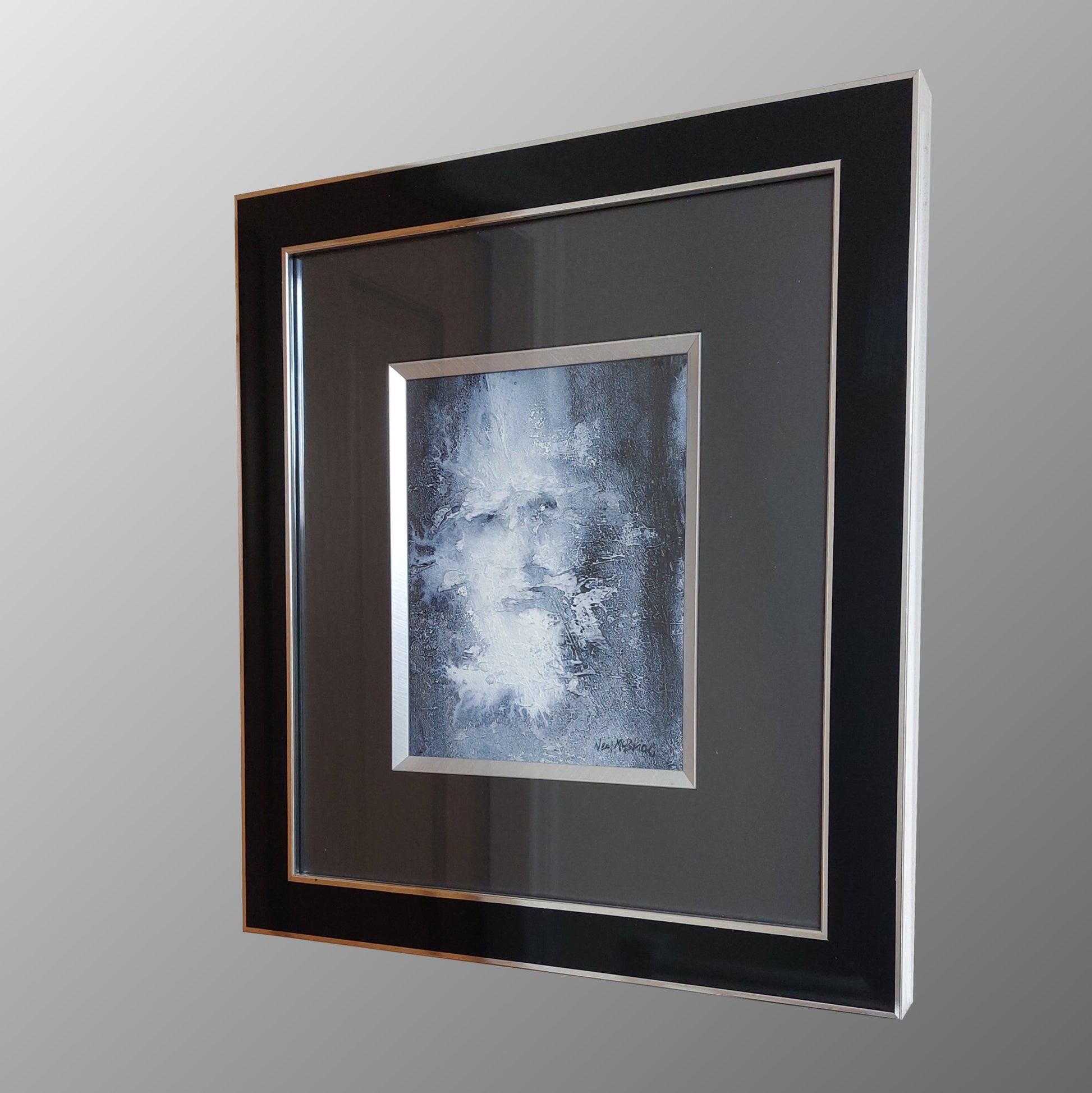 Framed wall art featuring an abstract portrait painting in blue, white, and grey tones, set within a black frame with a wide dark mat and a thin metallic inner border. © Neil McBride 2026