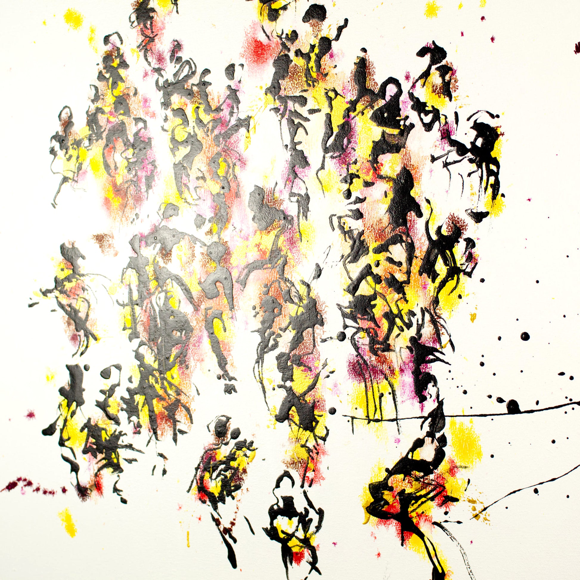 Abstract art with splashes of gold, yellow, black, and red on a pristine white background
