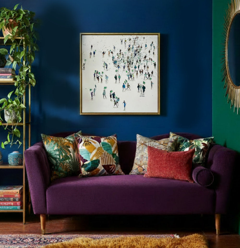 Painting titled Green Protest displayed in the corner of a bright multi coloured room with a purple sofa.